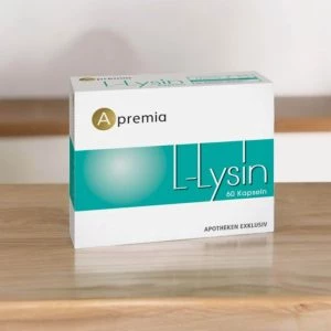 Apremia L-Lysin auf einem Holztisch